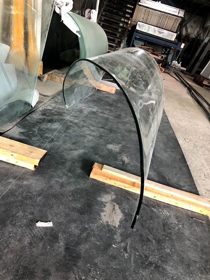 Curved white glass